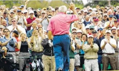  ?? AP FILE PHOTO ?? Arnold Palmer waves to the crowd after he two-putted the 18th to finish the day at 85 in the rain-delayed second round of the 2002 Masters. Palmer, who made golf popular for the masses with his hardchargi­ng style, incomparab­le charisma and a personal...