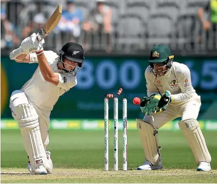  ?? PHOTOSPORT ?? New Zealand lose another wicket yesterday as Mitchell Santner is bowled by Marnus Labuschagn­e in Perth.