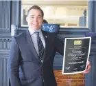  ??  ?? General Manager Marcel Wassen holding the award for Country House Hotel of the Year