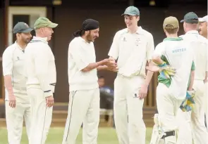  ?? ?? Jagsit Dhillon (centre) took 2-19 in Pinkneys Green's three-wicket defeat to Cadmore End on Saturday.