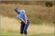  ?? ERIC RISBERG — THE ASSOCIATED PRESS ?? Stephen Curry chips the ball onto the ninth green during the Web.com Tour’s Ellie Mae Classic golf tournament Thursday in Hayward, Calif. Curry shot a 4-over-par 74.