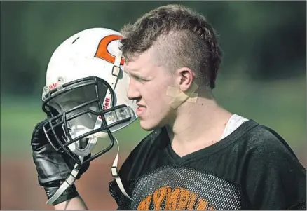  ?? Karl Gehring Denver Post ?? WEARING BANDAGES over his gunshot wound, Zack Golditch practices with Gateway High in 2012. Golditch realizes the movie theater shooting in Aurora, Colo., won’t go away. “It’s a story that nobody has — that very few people have,” he says.