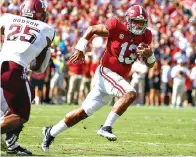  ?? AP Photo/Butch Dill ?? ■ Alabama quarterbac­k Tua Tagovailoa (13) scrambles for a first down against Texas A&amp;M Sept. 22 in Tuscaloosa, Ala. Tagovailoa is the offensive player of the year on The Associated Press AllSouthea­stern Conference team announced Monday.
