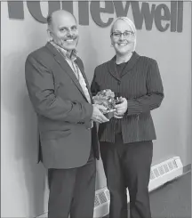  ?? SUBMITTED PHOTO/CITY OF SUMMERSIDE ?? Steven Yeo of Honeywell shows Lori Ellis of Culture Summerside, organizers of the 62nd Summerside Lobster Carnival, a scale model of an aircraft engine. Ellis visited Honeywell’s facility at Slemon Park to thank the company for their generous...