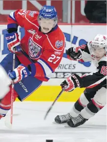  ?? REGINA LEADER- POST/ FILES ?? Austin Wagner of the Regina Pats, left, battles fellow Calgarian Brayden Point of the Moose Jaw Warriors during a WHL game last January.