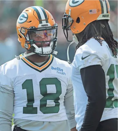  ?? MARK HOFFMAN / MILWAUKEE JOURNAL SENTINEL ?? The Packers’ Randall Cobb talks with fellow wide receiver Davante Adams during the second day of training camp Thursday.