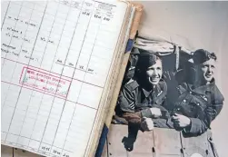  ??  ?? Piper, left, with an entry in his log book marking VJ Day.