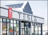  ??  ?? In this file photo, shows the Tesla Motors showroom in Salt Lake City. The Utah Supreme Court has ruled against Tesla in a push to sell its sleek, all-electric vehicles in the state. The court said in an opinion issued on Apirl 3, that Utah’s State Tax...