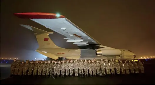  ??  ?? On the evening of January 24, 2020, a medical team formed by Third Military Medical University, drafting from its hardcore staff, rallies on the tarmac of Chongqing Jiangbei Internatio­nal Airport, ready to rush to Wuhan's recue overnight in fighting the COVID-19 outbreak.