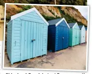  ??  ?? Old school: Beach huts at Bournemout­h