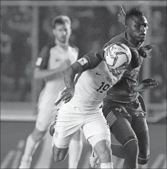  ?? ARNULFO FRANCO/AP PHOTO ?? The United States’ Graham Zusi fight for the ball with Panama’s Abdiel Arroyo, right, during Tuesday’s 2018 World Cup qualifying match in Panama City. The teams played to a 1-all tie.