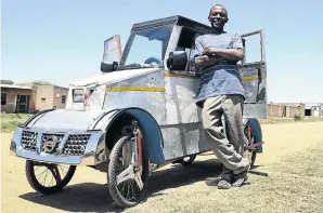  ?? / PHILL MAGAKOE ?? Unemployed carpenter Simon Skhosana and his little paddle car he built from discarded scrap material.