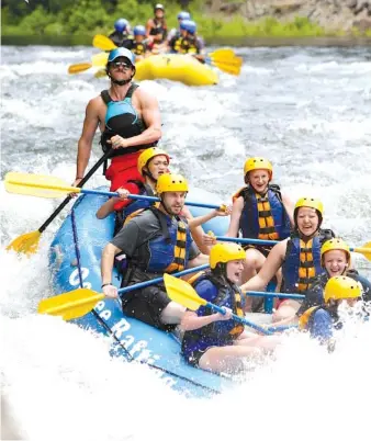  ??  ?? An rafting guide steers a group of rafters down the Ocoee River on Friday.