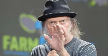  ?? Post-Gazette ?? Neil Young says Spotify is allowing a popular podcast host to spread vaccine misinforma­tion.