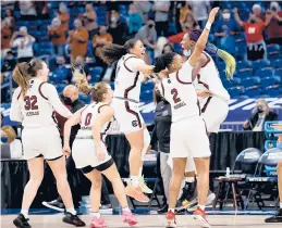  ?? ELSA/GETTY ?? South Carolina celebrates the win over Texas 62-34 on Tuesday to advance to the Final Four.