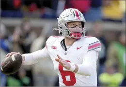  ?? AP photo ?? Ohio State quarterbac­k Kyle McCord throws during a game against Michigan in Ann Arbor, Mich. McCord went 111 as a starter with the Buckeyes and has looked polished throughout the spring.