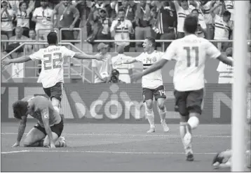  ?? KHALED DESOUKI/GETTY-AFP ?? Mexico’s Javier Hernandez, center, celebrates his goal in the 66th minute Saturday, which led to a win over South Korea.