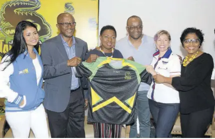  ?? (Photo: Joseph Wellington) ?? Jamaica Tallawahs’ CEO Jefferson Miller (second left) poses with the franchise’s T-shirt, along with (from left) Elizabeth Allen of Pepsi; Sports Minister Olivia Grange; Director of Tourism Donovan White; Kathryn Silvera of Foska Oats, and Prudence Simpson of Jamaica Pegasus hotel.