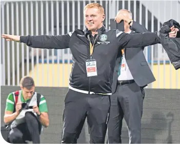  ??  ?? Neil Lennon celebrates in Greece after Hibs reached the next stage of the Europa League