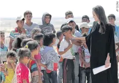  ??  ?? Actress Angelina Jolie, shown here during a visit to a camp for Syrian refugees in Jordan in 2016, has been an inspiratio­n to Japanese musician Miyavi. “She has six kids and she’s doing all this. I have no excuse,” he says.