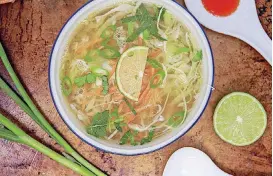  ?? [PHOTO BY MELISSA D’ARABIAN/AP] ?? This cabbage soup is made with ginger and garlic broth from a recipe by Melissa d’Arabian.