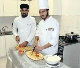  ??  ?? Mohammed Yusuf Ismail and Huzaifah Mohideen showcase their culinary skills.