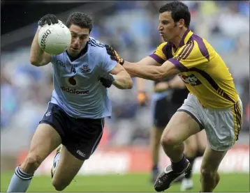  ??  ?? Dublin dangerman Bernard Brogan taking on Wexford full-back Graeme Molloy.