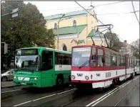  ?? AP ?? A public bus and train carry passengers for free on a street in Tallinn, the Estonian capital.