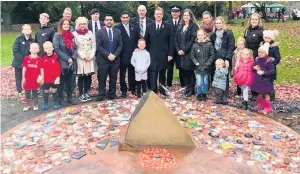  ??  ?? Dignitarie­s including Ramsbottom MP James Frith joined organisers and visitors admiring the new Nuttall Park memorial
