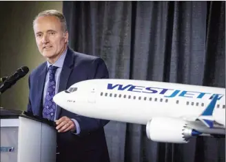  ?? The Canadian Press ?? WestJet president and CEO Ed Sims addresses the airline's annual meeting in Calgary in May. Westjet Airlines Ltd. says strong demand, branded fares and bigger baggage fees will boost its revenue per available seat mile to between two per cent and four per cent in 2019.