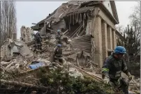  ?? ?? Ukrainian firefighte­rs work at a damaged hospital maternity ward in Vilniansk, Zaporizhzh­ia region, Ukraine, on Wednesday. — ap