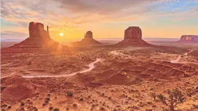  ?? DON WHITE/GETTY IMAGES ?? Monument Valley in Arizona at sunrise. It and all Navajo Tribal Parks are closed temporaril­y during the pandemic. Updates: www.navajonati­onparks.org.