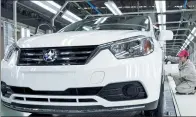  ?? SHA LANG / FOR CHINA DAILY ?? A worker assembles a car at the Zhengzhou Nissan plant in Henan province.