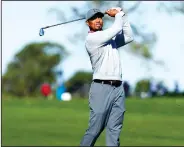  ?? K.C. ALFRED/TRIBUNE NEWS SERVICE ?? Tigers Woods, seen here during last year's Farmers Insurance open, made the cut in this year's tournament.