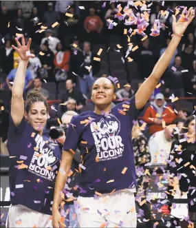  ?? Frank Franklin II / Associated Press ?? UConn’s Kia Nurse, left, and Azura Stevens, right, throw confetti as they celebrate after a regional final against South Carolina at the NCAA Women’s Tournament on Monday in Albany, N.Y. Connecticu­t won 94-65.