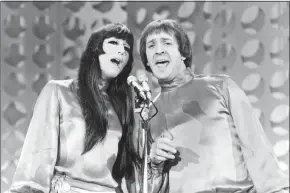  ?? Associated Press ?? Sonny, right, and Cher sing during a taping of “The Danny Thomas Special” in Los Angeles. Cher has sued the widow of her former musical partner and ex-husband Sonny Bono over royalties for Sonny and Cher songs, including “I Got You Babe” and “The Beat Goes On.”