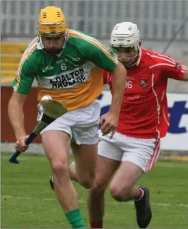  ??  ?? Duffry Rovers centre-back Paul Nolan moving away from Joe Sutton (Fethard).