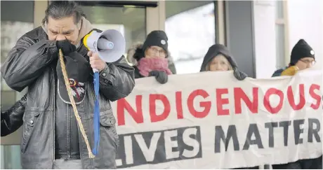  ?? MARK TAYLOR/THE CANADIAN PRESS ?? Walter Red Thunder, left, from Red Pheasant First Nation gets emotional during a rally in Regina on Saturday following the not-guilty verdict in the Gerald Stanley trial. Protests across the country are a reflection of the trial’s tremendous symbolic importance.