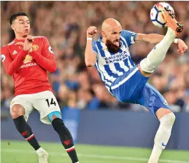  ?? AFP ?? Manchester United’s English midfielder Jesse Lingard (left) looks on as Brighton’s Spanish defender Bruno Saltor clears the ball during their English Premier League match at the American Express Community Stadium in Brighton. —