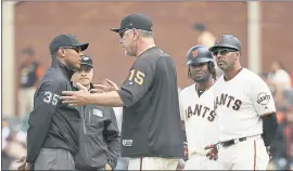  ?? ERIC RISBERG — THE ASSOCIATED PRESS ?? Manager Bruce Bochy tries to get Jeremie Rehab, left, to change his mind after the umpire called Alen Hanson, second from right, out for turning inside the baseline.