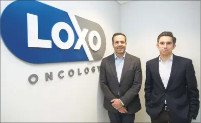  ?? Michael Cummo / Hearst Connecticu­t Media ?? Loxo Oncology founder and CEO Josh Bilenker, left, and Chief Business Officer Jacob Van Naarden inside the company’s headquarte­rs on Tresser Boulevard.