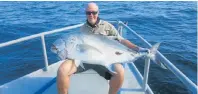  ??  ?? WHAT A BEAUTY!: Angling in Tanzania off Mafia Island at present, Larry Keogh landed this giant trevally