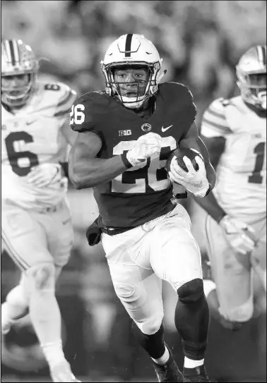  ?? CHRIS KNIGHT/THE ASSOCIATED PRESS ?? Penn State running back Saquon Barkley carries against Ohio State during the first half of the Nittany Lions’ 24-21 upset of the No. 2-ranked Buckeyes in State College, Pa., on Saturday.