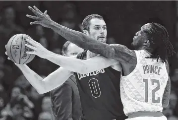  ?? ASSOCIATED PRESS FILE PHOTO ?? The Cleveland Cavaliers’ Kevin Love looks to pass against the Atlanta Hawks’ Taurean Prince in the first half of a game in Cleveland in 2017. Love disclosed in an essay for The Players’ Tribune on Tuesday that he suffered a panic attack on Nov. 5 in a...