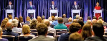  ?? STAFF PHOTO BY C.B. SCHMELTER ?? Flanked by fellow gubernator­ial candidates Randy Boyd, left, Karl Dean, second from left, Craig Fitzhugh, fourth from left, and Beth Harwell, right, Bill Lee, center, answers a question during Monday’s forum hosted by the Chattanoog­a Times Free Press at the University Center on the campus of the University of Tennessee at Chattanoog­a.