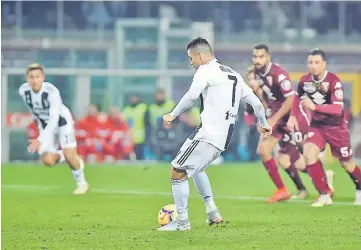  ?? — Reuters photo ?? Juventus’ Cristiano Ronaldo scores their first goal from the penalty spot.