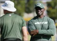  ?? STEVE HELBER — THE ASSOCIATED PRESS ?? Head coach Todd Bowles, right, watches warmups during the Jets-Redskins joint training camp in Richmond, Va., Tuesday.