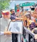  ?? HT PHOTO ?? PM Narendra Modi accepts a portrait of his mother, made by a local artist, in Shimla.