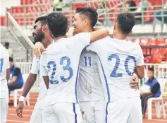  ??  ?? Malaysia’s players celebrate after they defeated Indonesia in the opening match of Under-23 Group AFC qualificat­ion at Supachalas­ai National Stadium. — Bernama photo