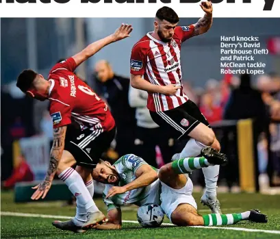  ??  ?? Hard knocks: Derry’s David Parkhouse (left) and Patrick McClean tackle Roberto Lopes